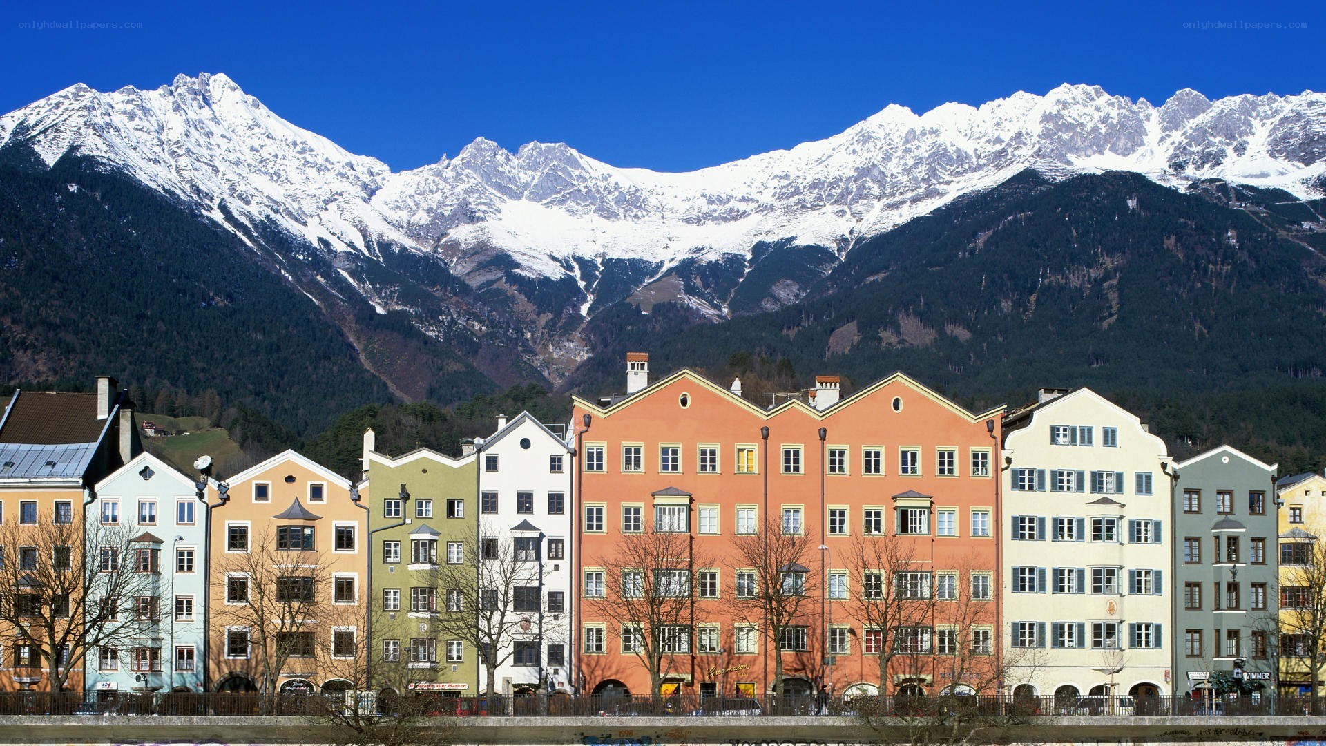 Colorful buildings with mountain backdrop