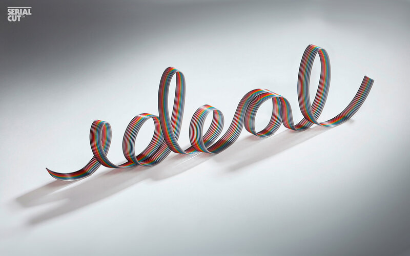 Colorful cable forming the word ideal
