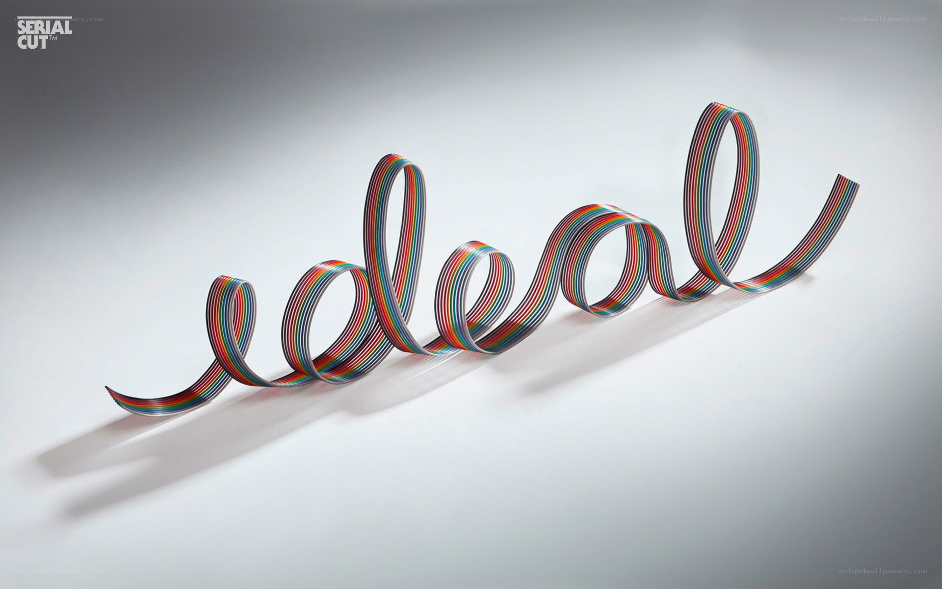 Colorful cable forming the word ideal