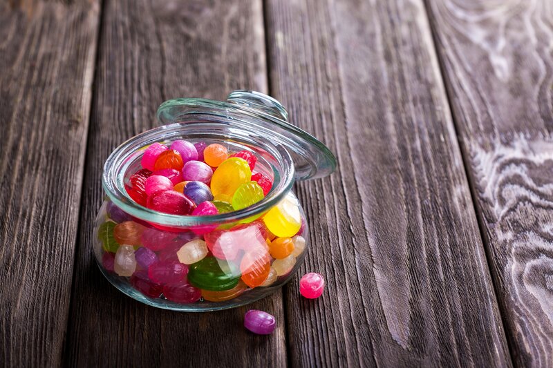 Colorful candies in a glass jar