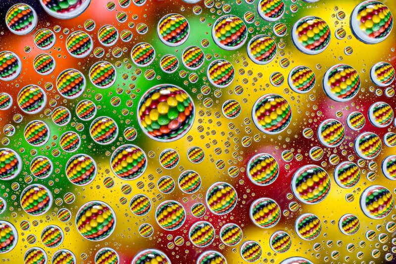 Colorful Candies in Water Droplets