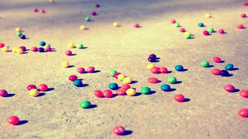 Colorful candies scattered on ground