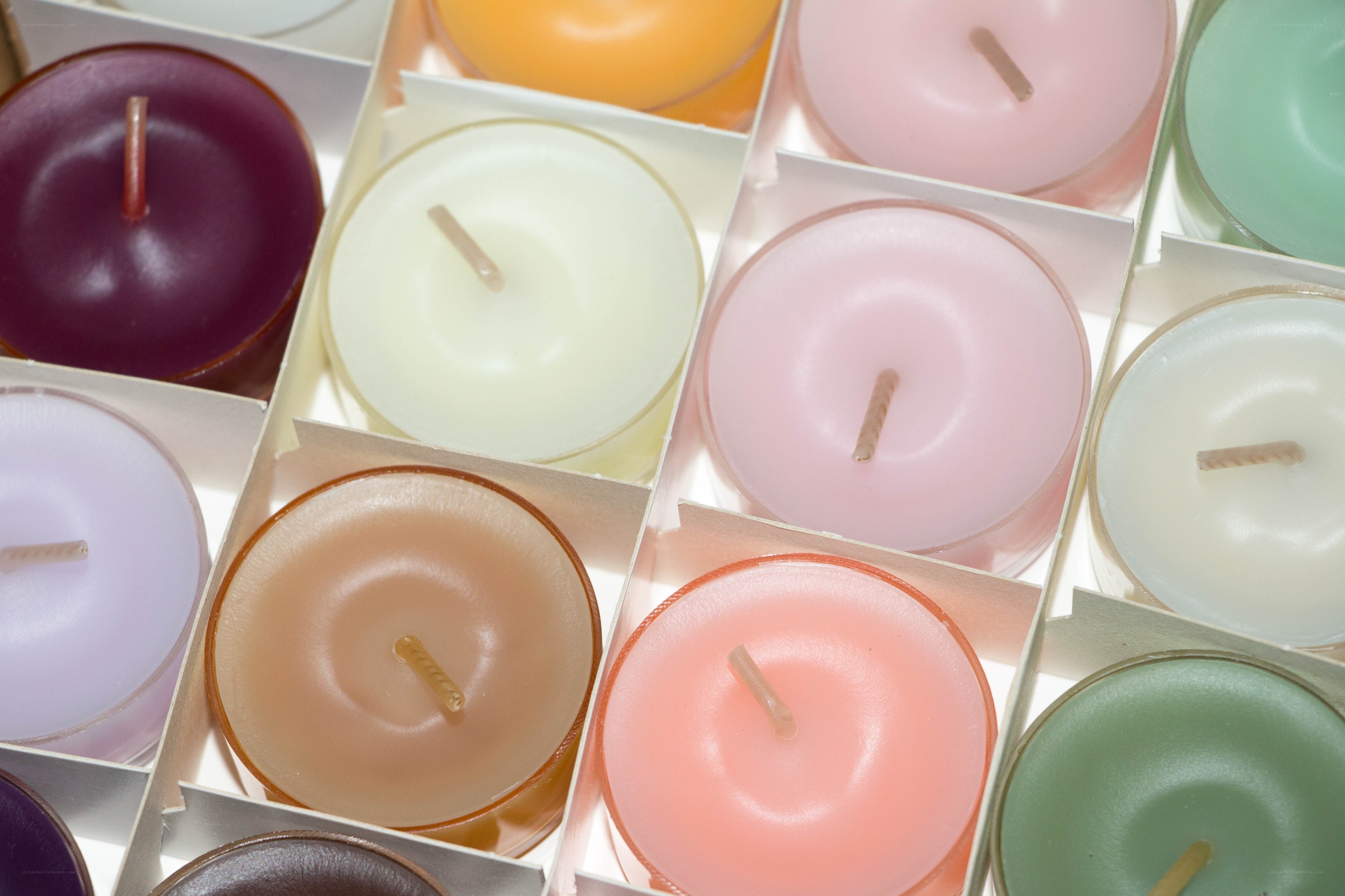 Colorful candles in a box