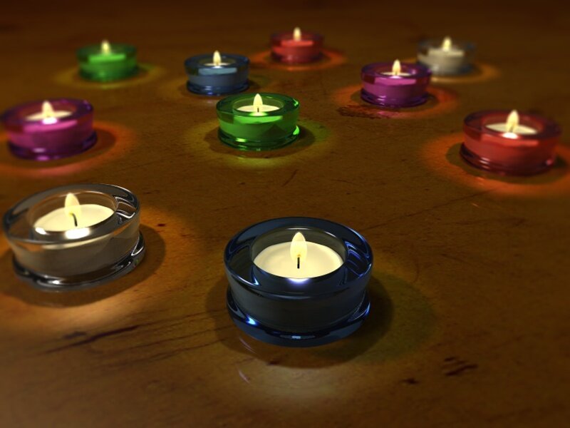 Colorful candles on wood