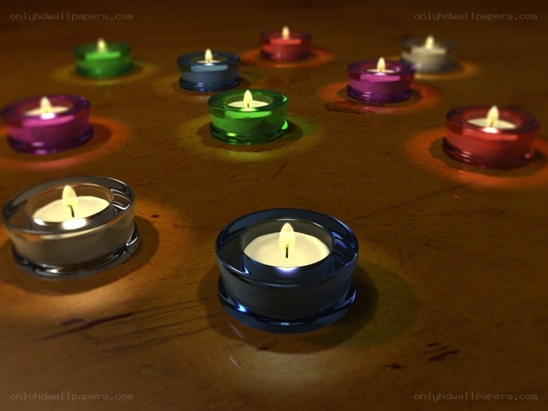 Colorful candles on wood