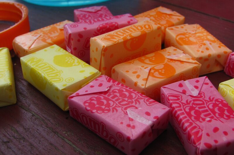 Colorful candy wrappers on wood