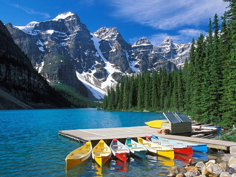 Colorful canoes at a mountain lake
