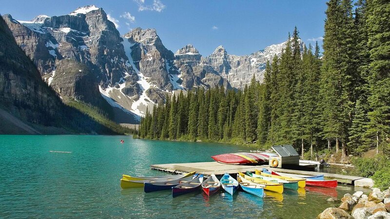 Colorful canoes at a mountain lake