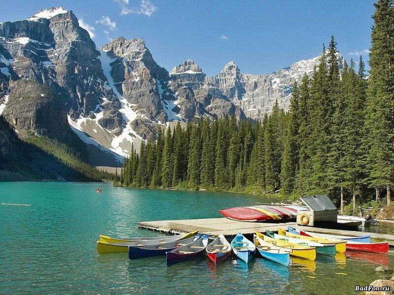 Colorful canoes at a mountain lake