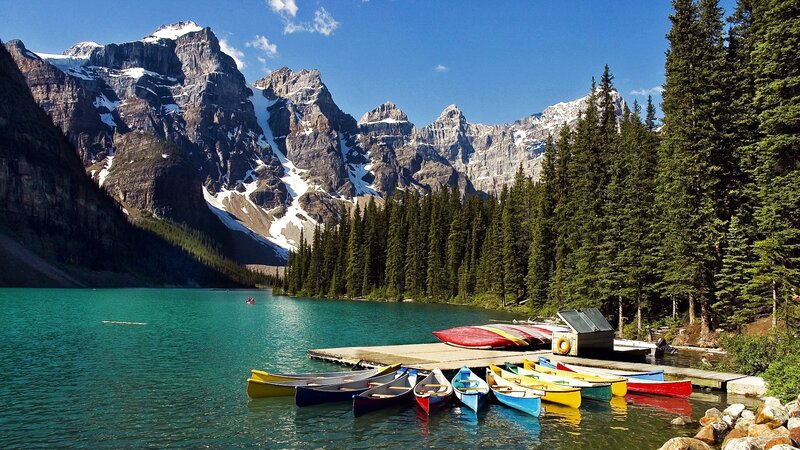 Colorful canoes at a mountain lake