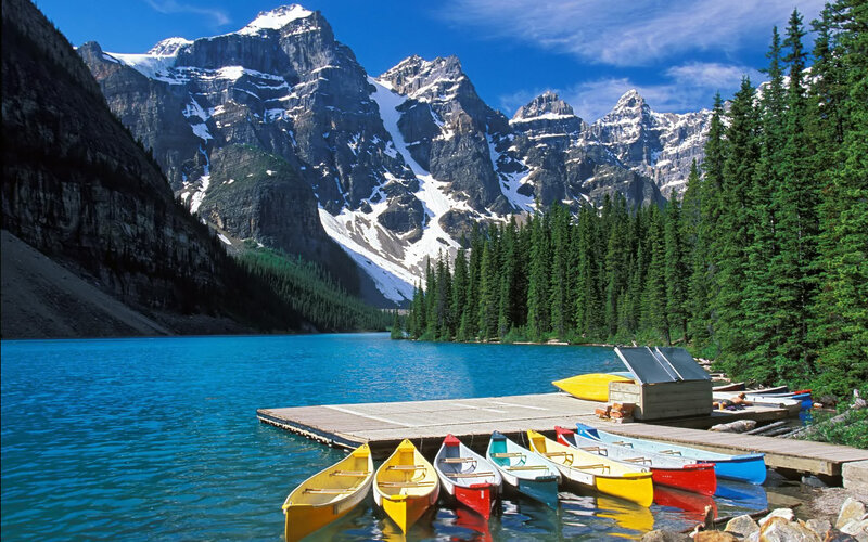 Colorful canoes at a mountain lake