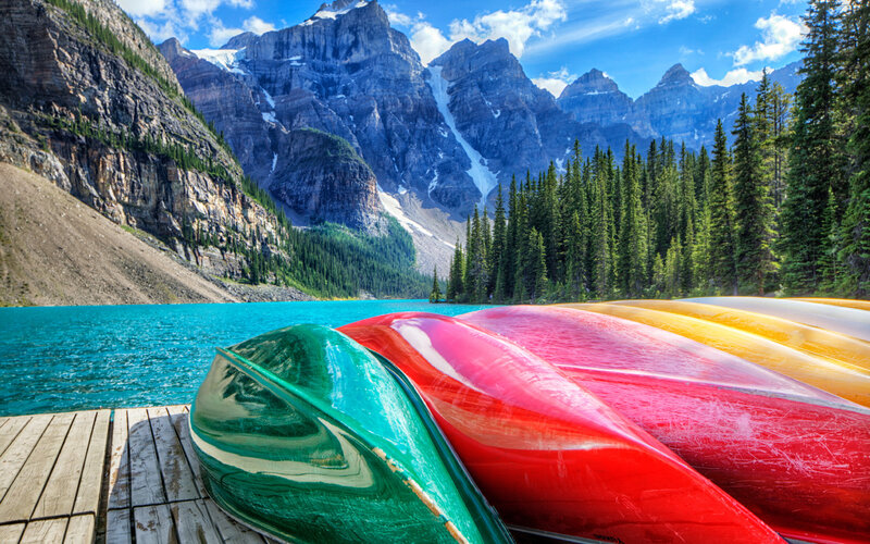 Colorful Canoes on Dock — Green