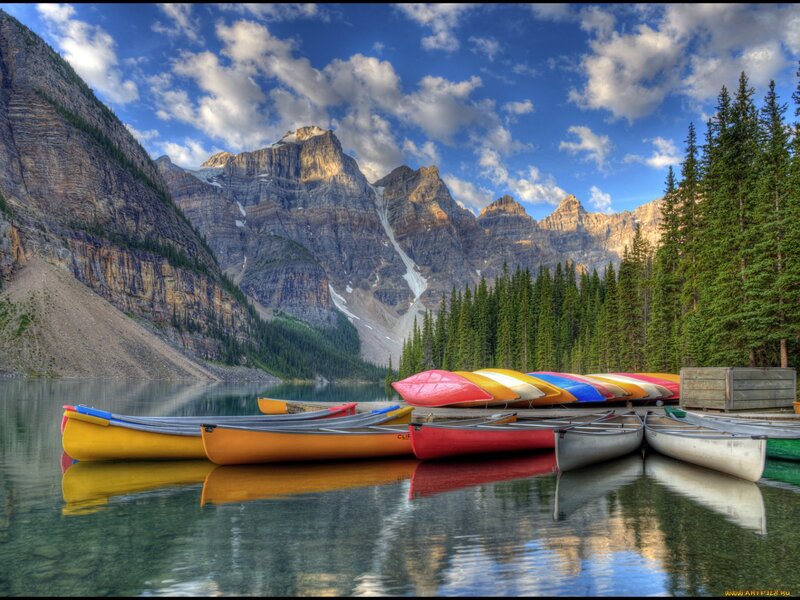 Colorful Canoes on Lake — Blue
