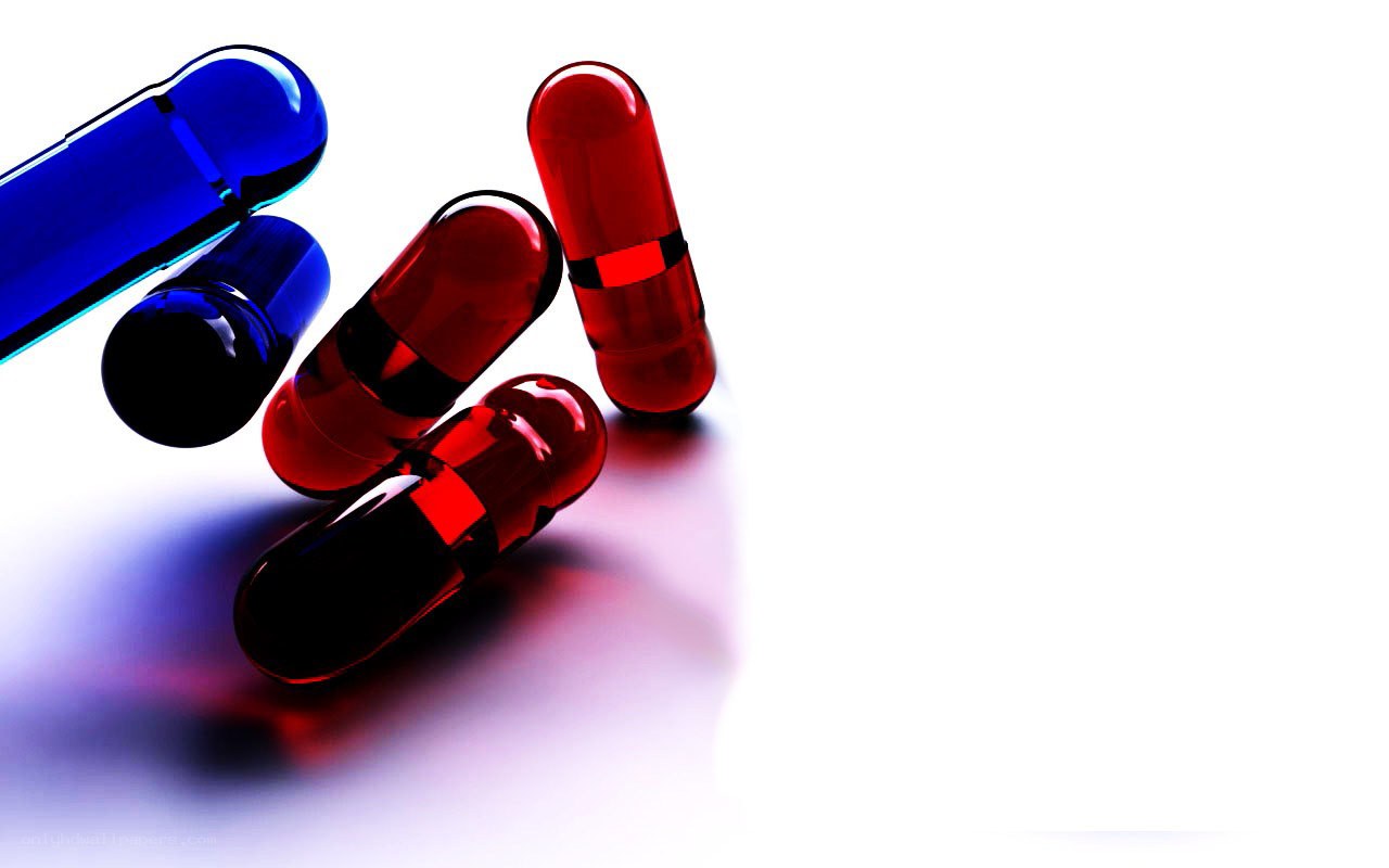 Colorful capsules on white surface