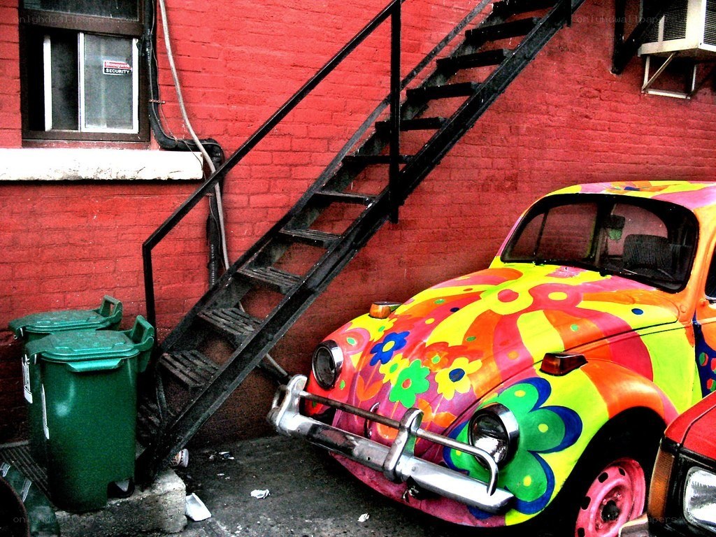 Colorful car by fire escape