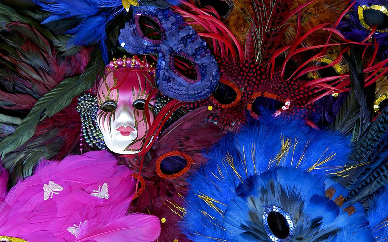 Colorful carnival masks and feathers