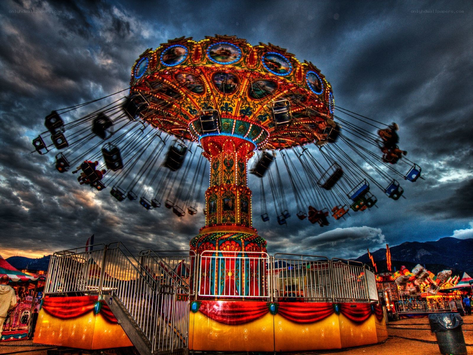 Colorful carousel under stormy sky