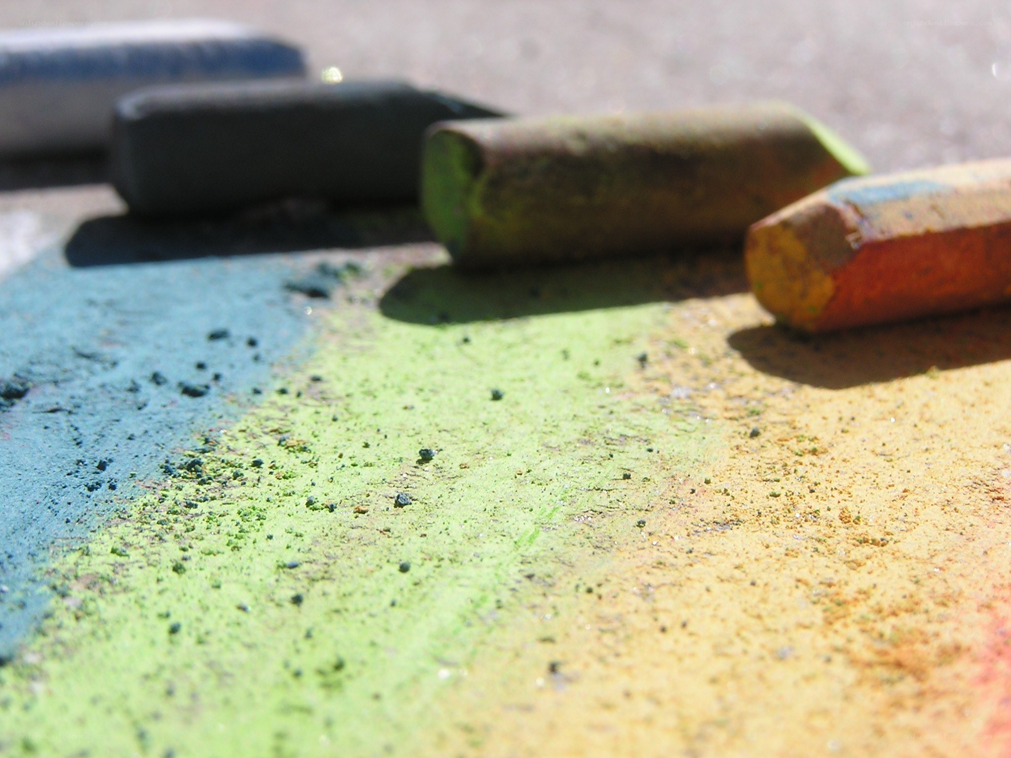 Colorful chalk on pavement