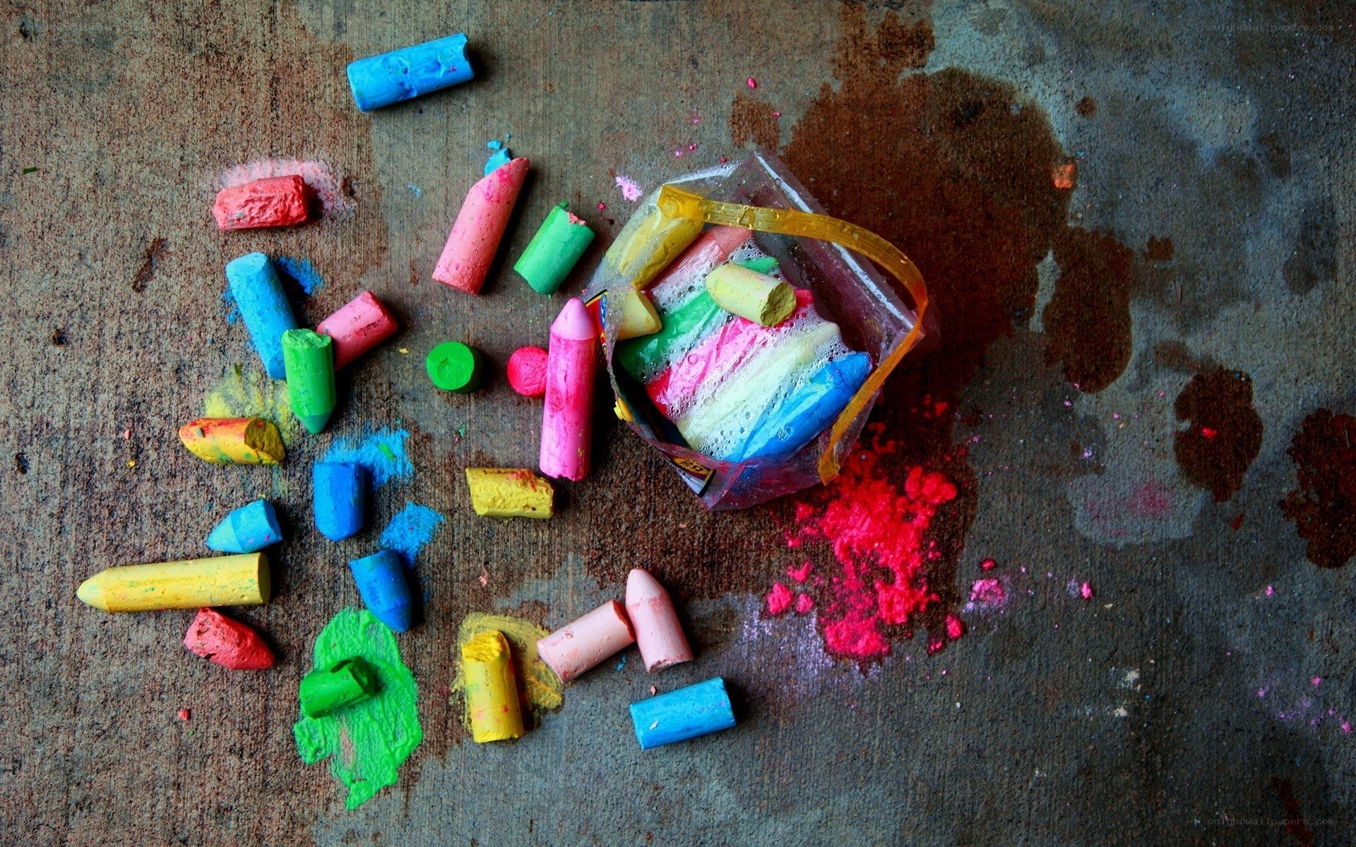 Colorful chalk scattered on ground