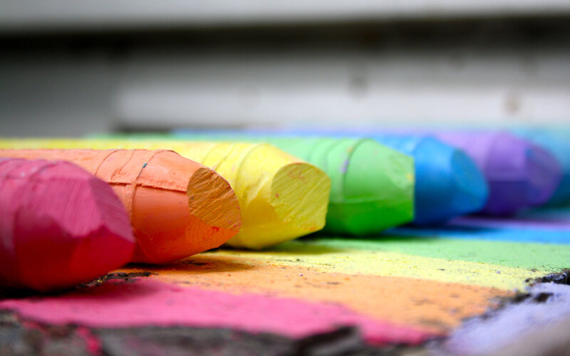 Colorful chalk sticks in a row