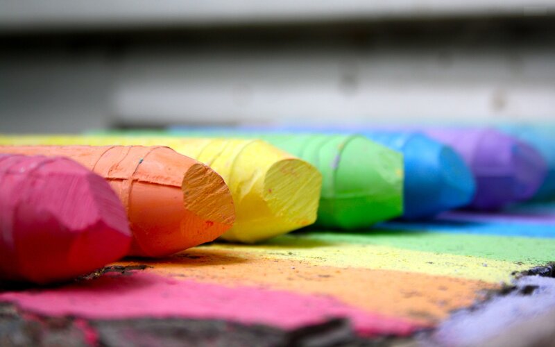 Colorful chalk sticks in a row