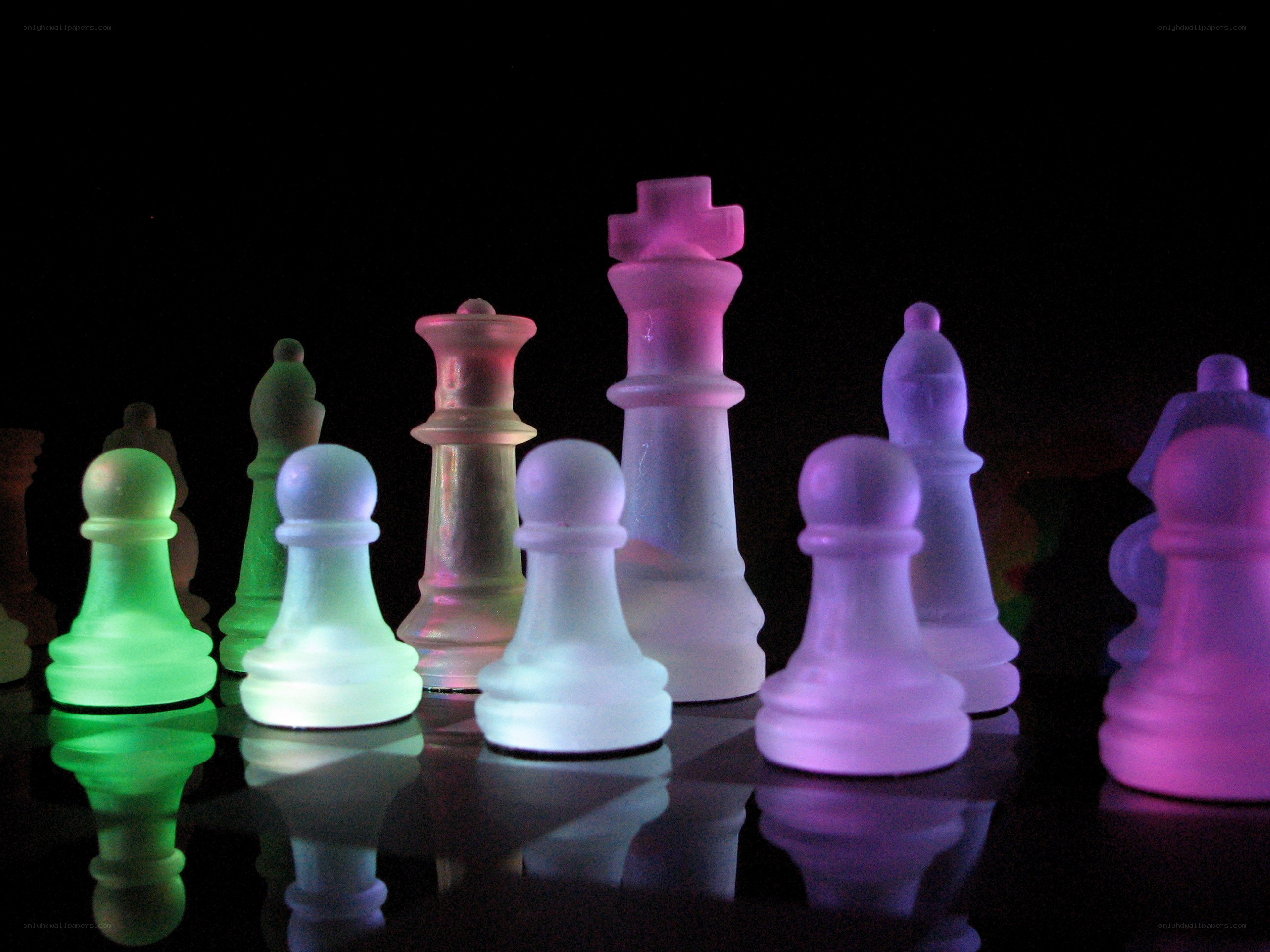 colorful chess pieces on black