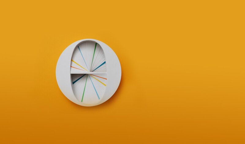 colorful clock on orange wall