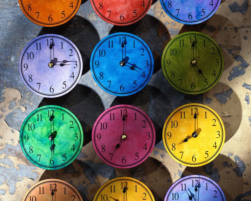 Colorful clocks on a wall