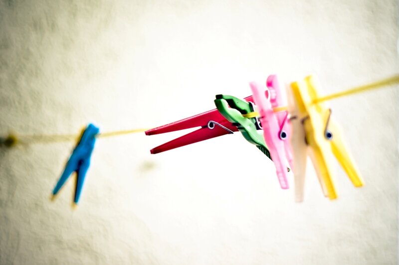 Colorful Clothespins on Line — Red