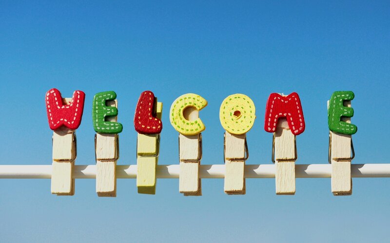 Colorful Clothespins Spelling Welcome