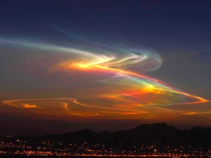 Colorful clouds over city
