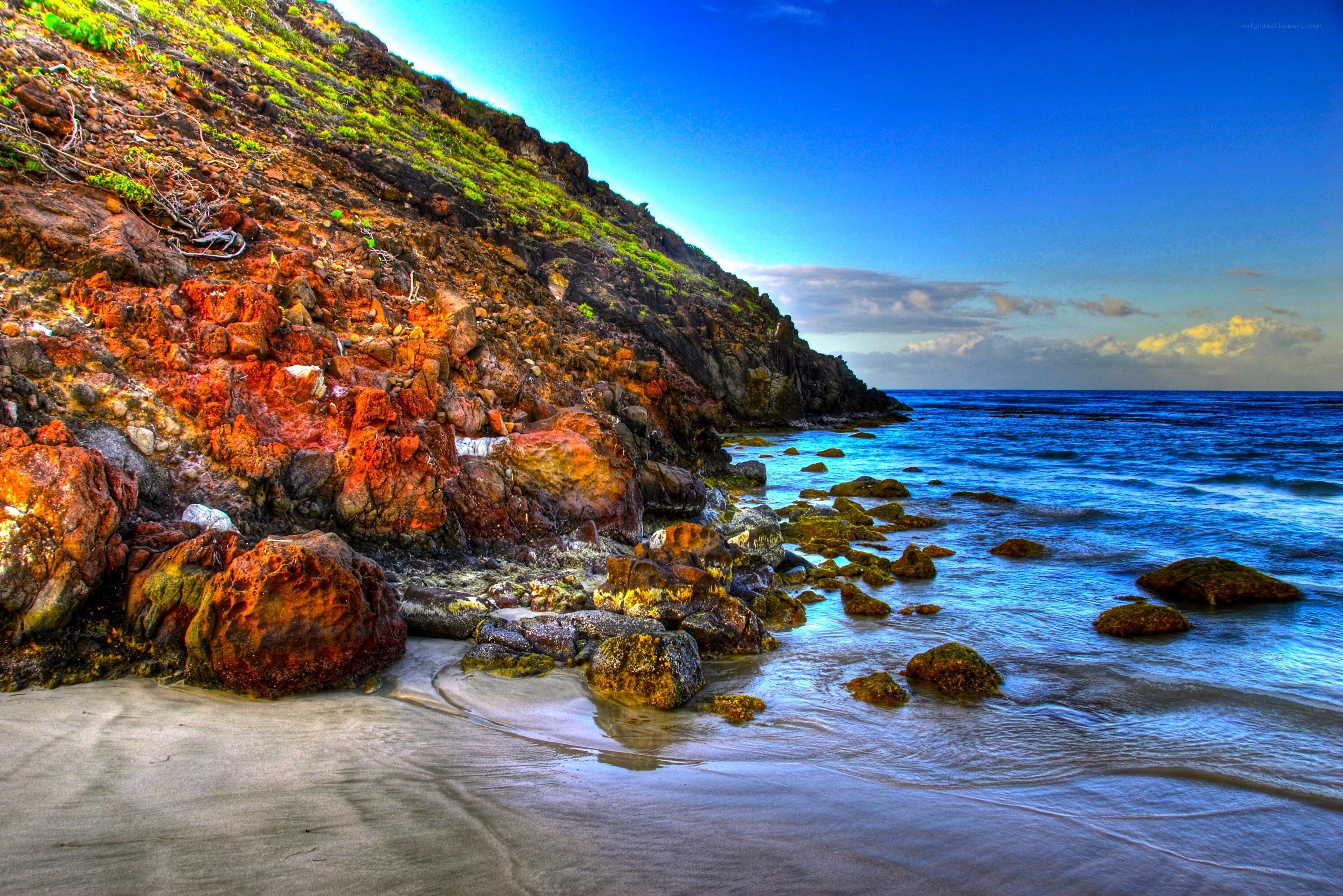 Colorful coastal rocks and ocean
