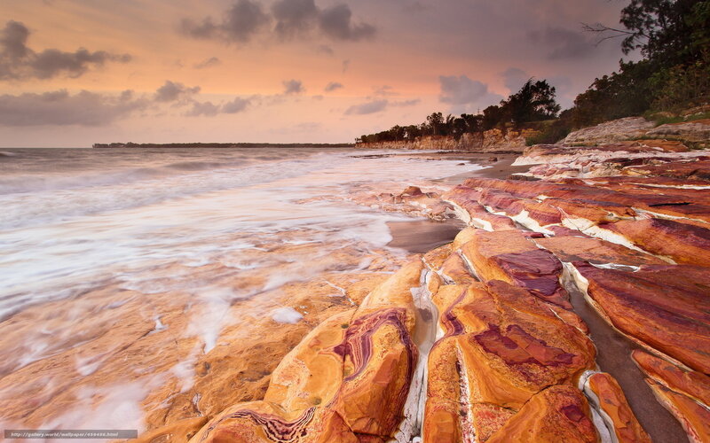 Colorful coastal rocks at sunset