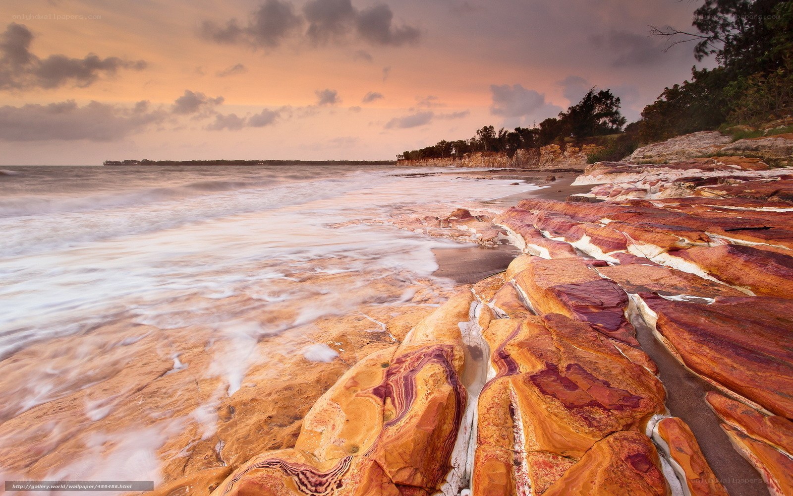 Colorful coastal rocks at sunset