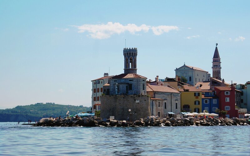 Colorful coastal town with historic tower