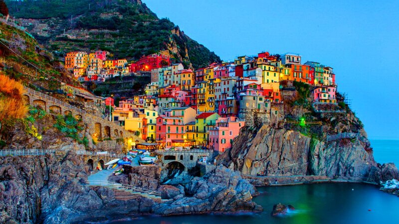 Colorful coastal village at dusk