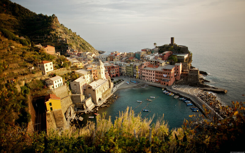 colorful coastal village at sunset
