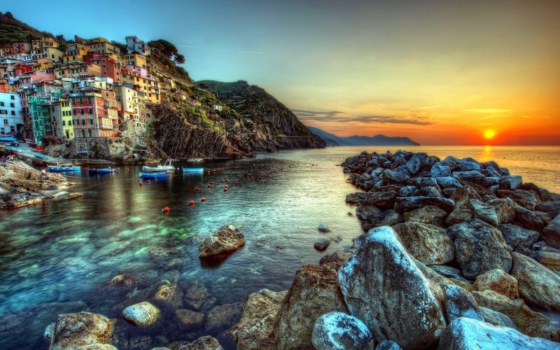 Colorful coastal village at sunset