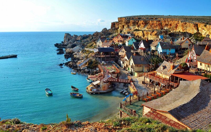 Colorful Coastal Village — Blue, Serene, Afternoon, Photograph, Cliffs
