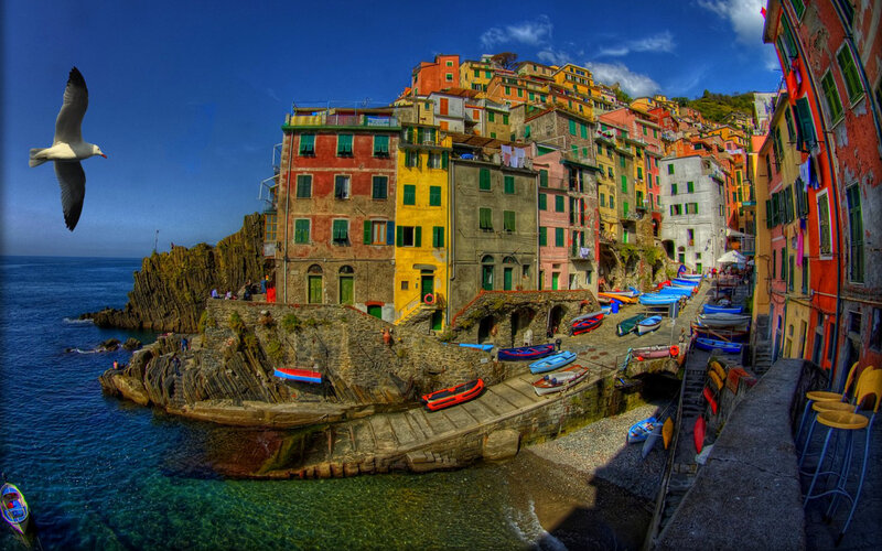 Colorful Coastal Village — Blue, Vibrant