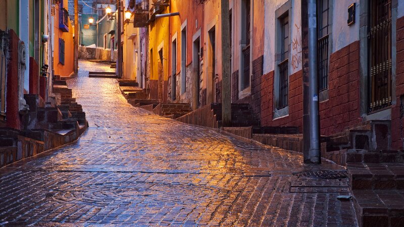 Colorful cobblestone alley at dusk