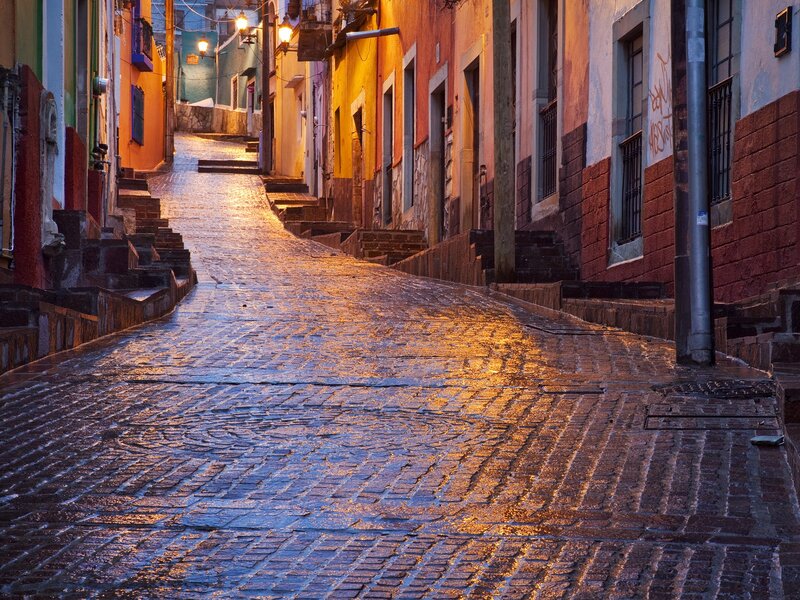 Colorful cobblestone street at dusk