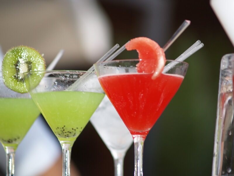 Colorful cocktails with fruit garnish