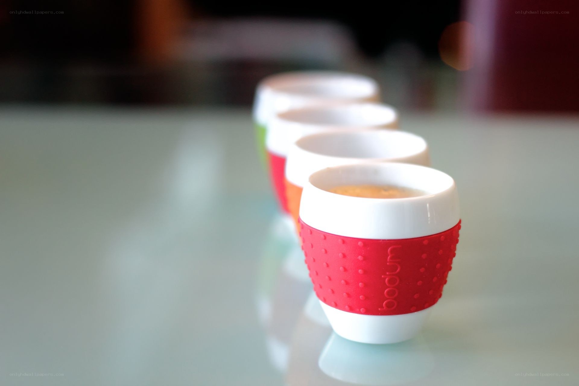 Colorful coffee cups in a row