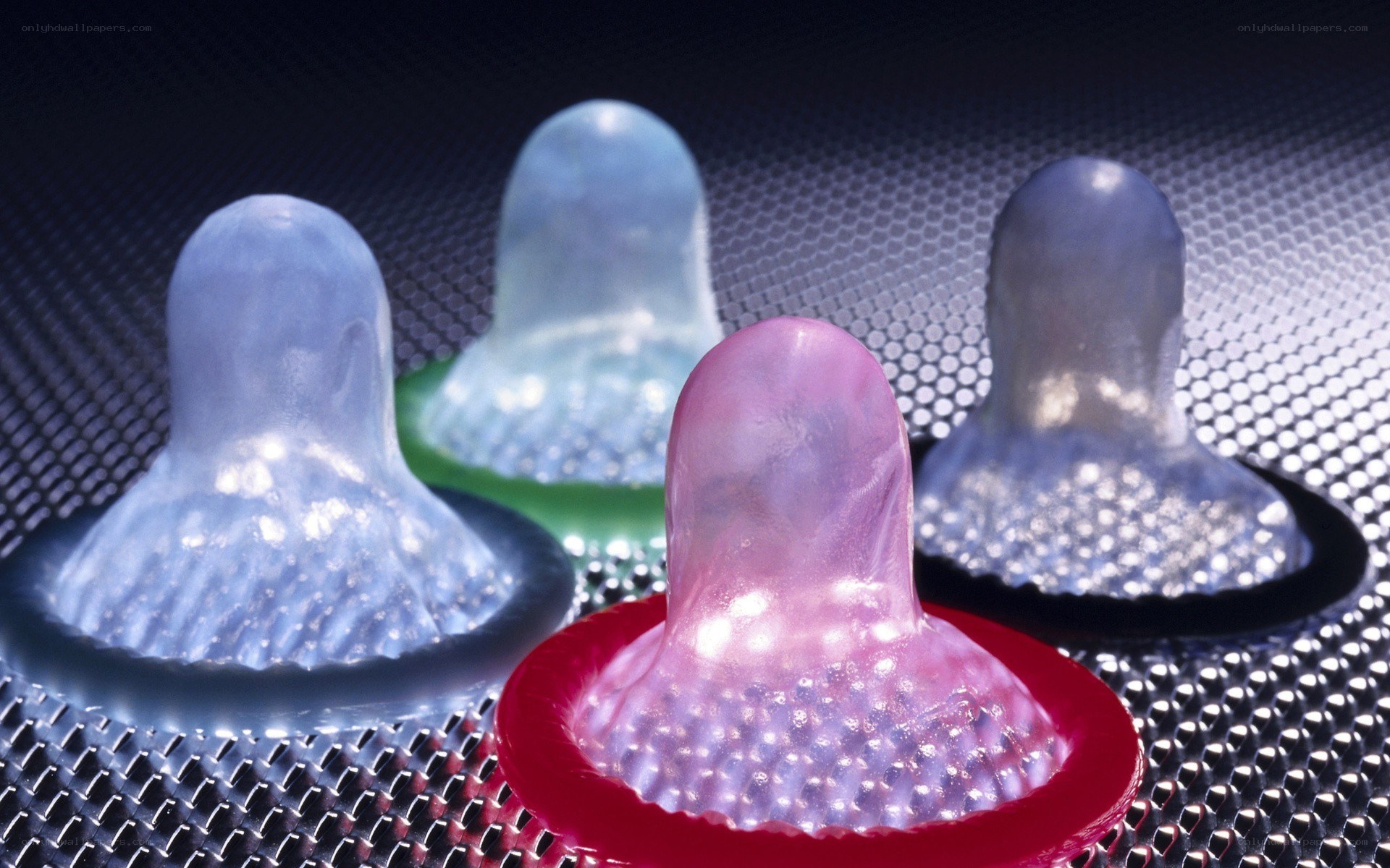 Colorful condoms on mesh