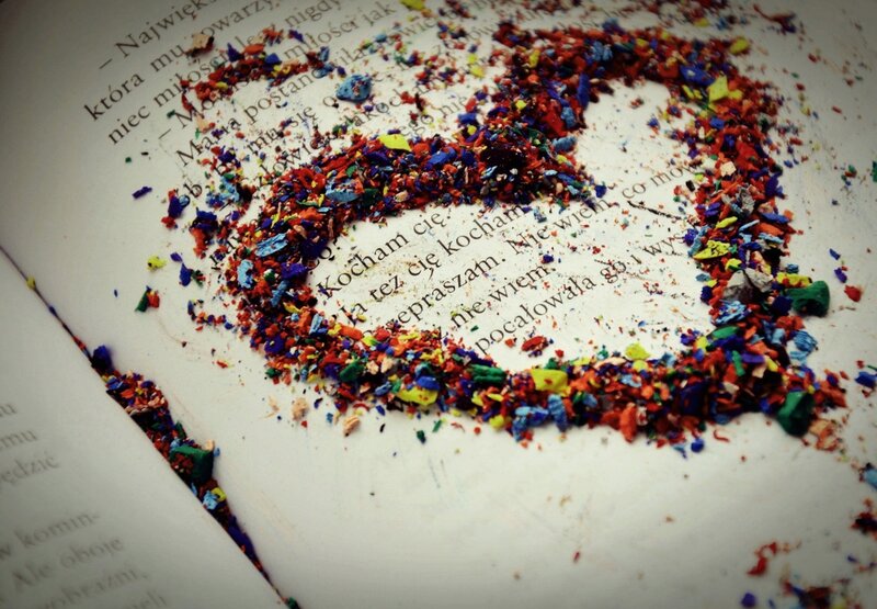 Colorful crayon shavings in heart shape