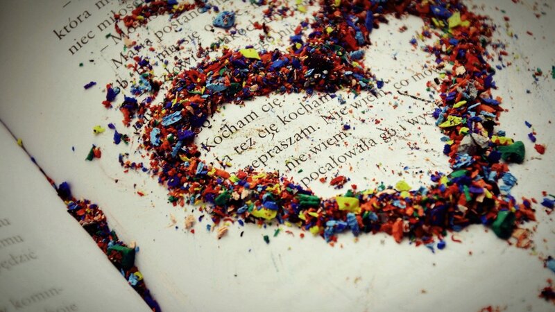 Colorful crayon shavings on a book