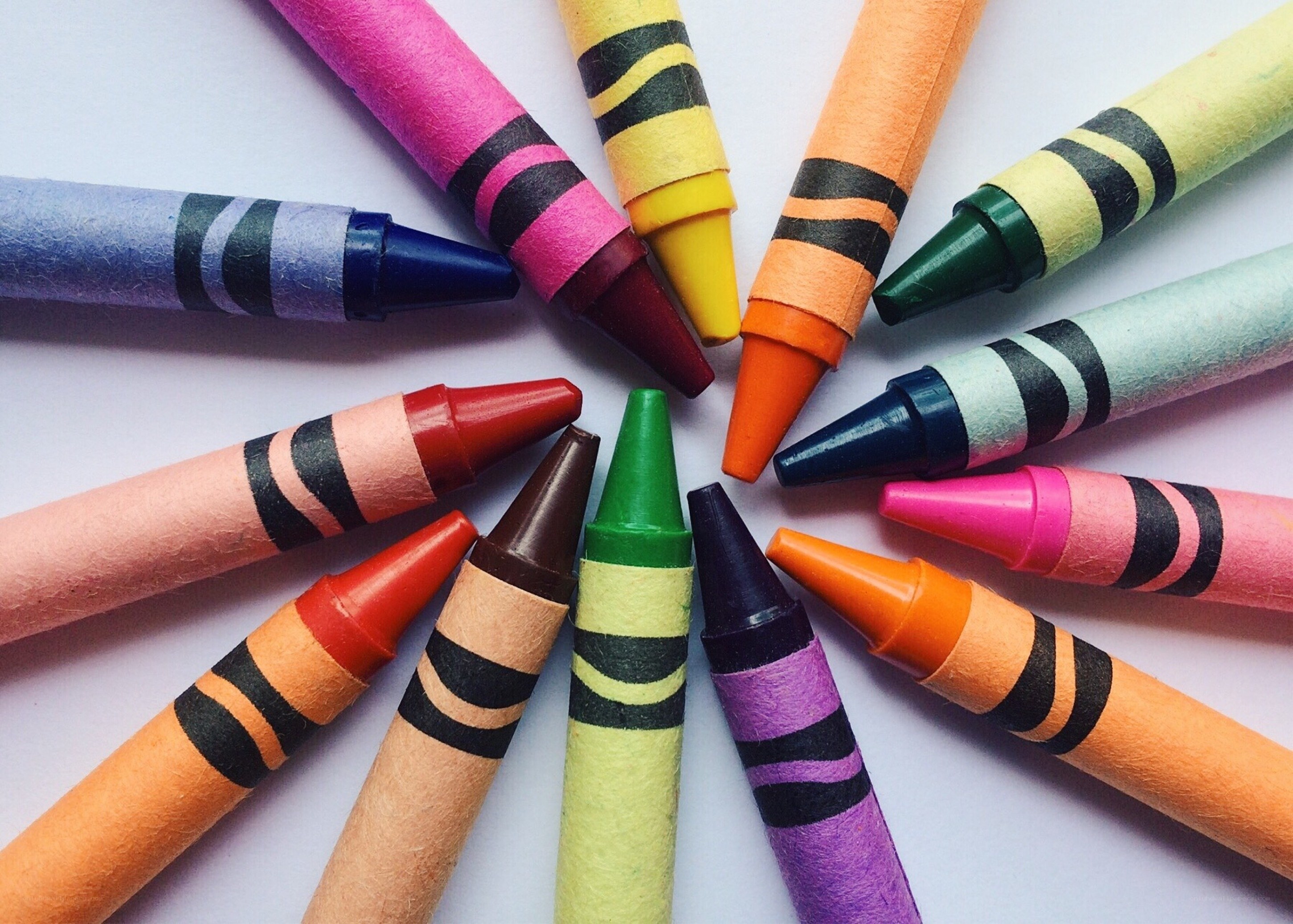 Colorful crayons arranged in a circle