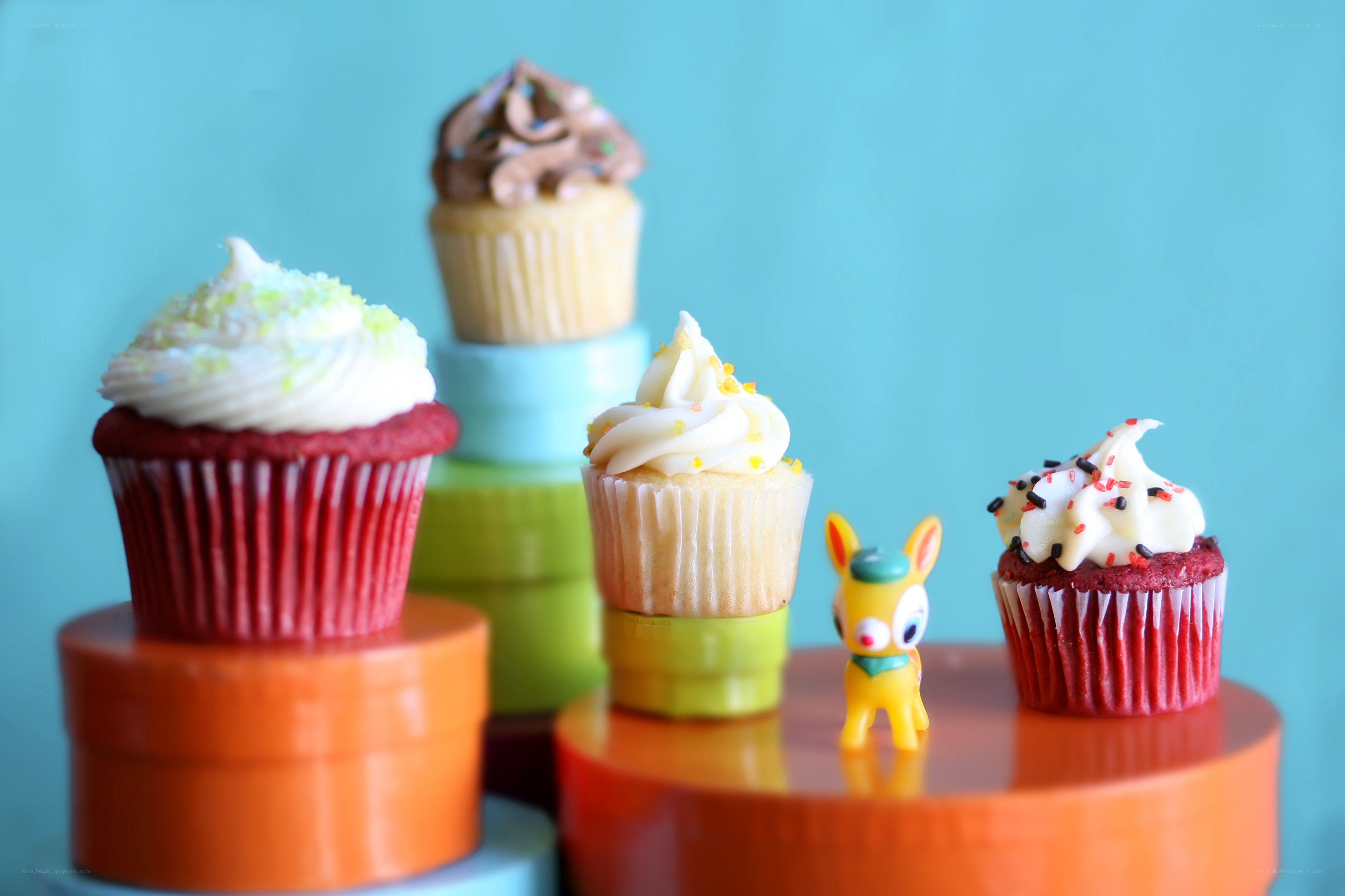 Colorful cupcakes on stands