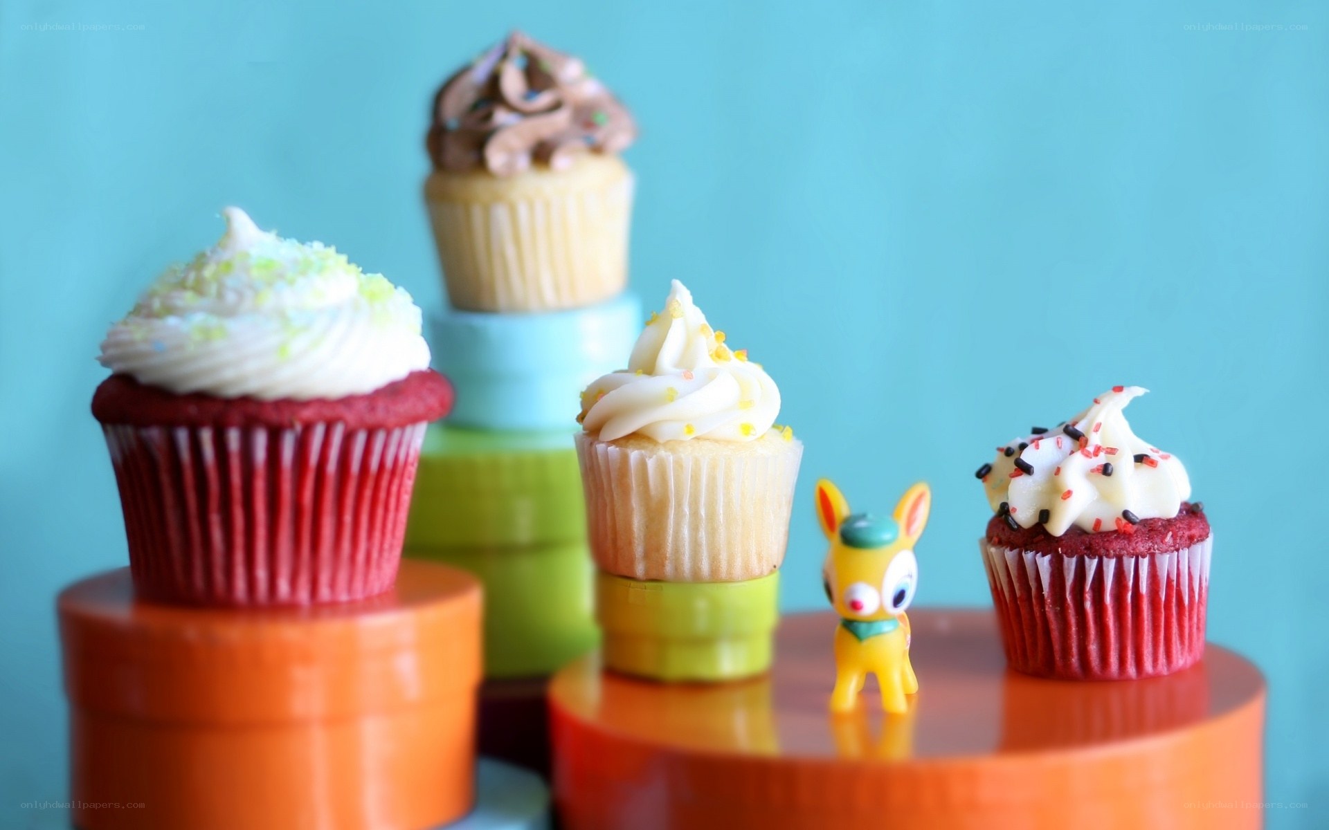 Colorful cupcakes on stands